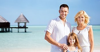 summer holidays, travel, tourism, vacation and people concept - happy family over exotic tropical beach with bungalow hut background