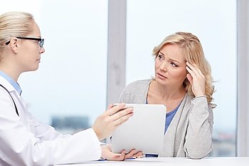 medicine, health care and people concept - doctor with tablet pc computer and unhappy ill woman meeting at hospital