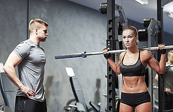 sport, fitness, bodybuilding, lifestyle and people concept - man and woman with barbell flexing muscles in gym