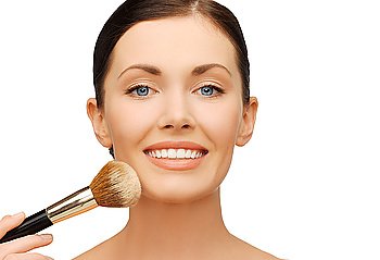 beauty and make-up concept - woman applying powder foundation with brush. woman applying powder foundation with brush