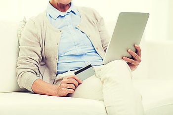 technology, online shopping, age and people concept - close up of senior woman with tablet pc computer and credit or bank card at home