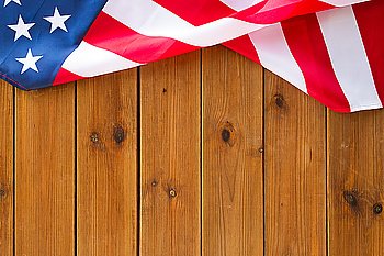 american independence day, patriotism and nationalism concept - close up of american flag on wooden boards