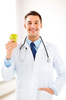 bright picture of male doctor with green apple