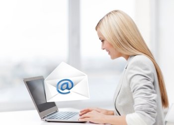 picture of beautiful woman with laptop computer sending email