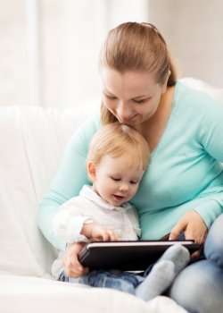happy mother and adorable baby with tablet pc
