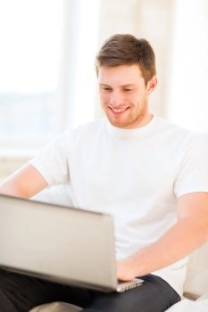 handsome man working with laptop at home
