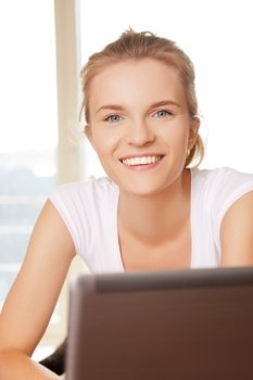 picture of happy teenage girl with laptop computer