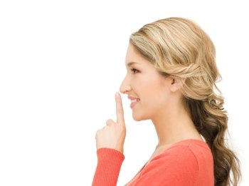 picture of happy woman with finger on lips
