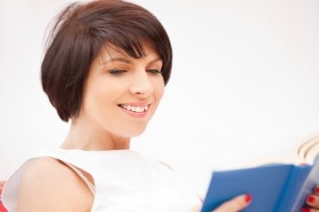 bright picture of happy and smiling woman with book