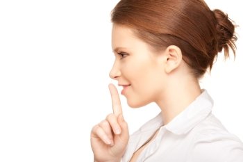 bright picture of teenage girl with finger on lips
