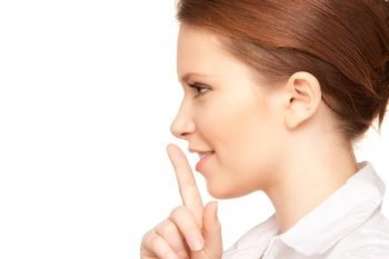 bright picture of teenage girl with finger on lips
