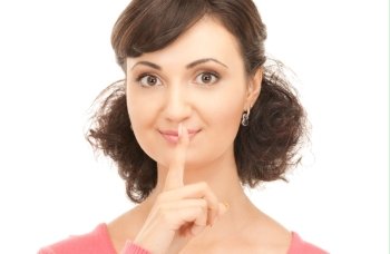 bright picture of young woman with finger on lips
