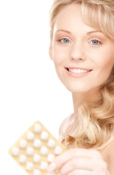 picture of young woman with pills over white