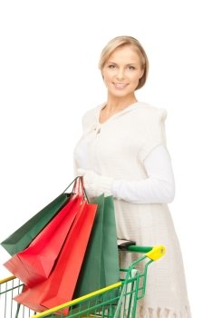 lovely woman with shopping cart over white
