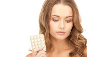 picture of young beautiful woman with pills 