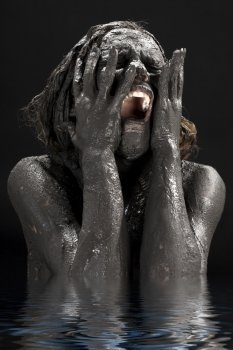 picture of crying dirty woman in water