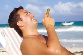 picture of relaxed man with cigar on the beach