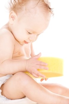 picture of baby boy with sponge over white
