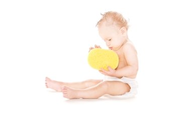 picture of baby boy with sponge over white