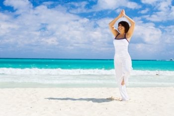 meditation of happy woman on the beach