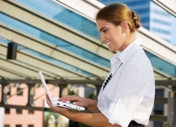 picture of happy businesswoman with laptop computer