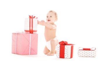 picture of baby boy with gifts over white