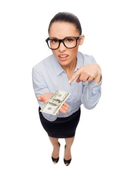 business, money and banking concept - smiling businesswoman in eyeglasses pointing finger to dollar cash money