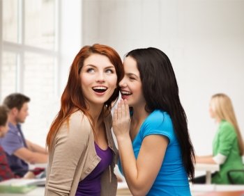 friendship, happiness and education concept - two smiling girls whispering gossip