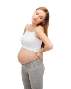 pregnancy, motherhood and happiness concept - tired future mother supporting her back
