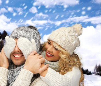 winter holidays, family, vacation and lifestyle concept - family couple in a winter clothes