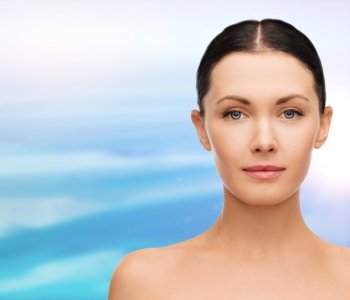 health, spa and beauty concept - clean face of beautiful young woman