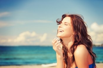 bright picture of laughing woman on the beach