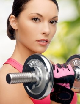 sport, fitness and healthcare concept - beautiful asian sporty woman with heavy dumbbell