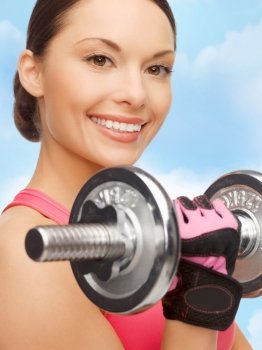 sport, fitness and healthcare concept - beautiful asian sporty woman with heavy dumbbell