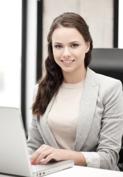 picture of smiling businesswoman using her laptop computer