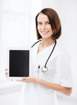 healthcare and medical concept - female doctor with tablet pc