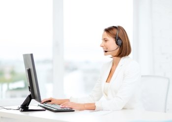business, communication, technology and call center concept - friendly female helpline operator with headphones and computer call center