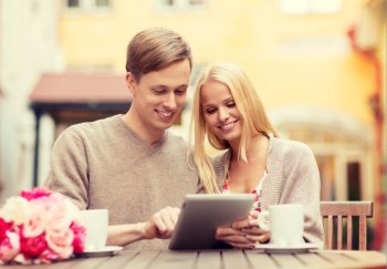 summer holidays, city, dating and technology concept - couple with tablet pc in cafe