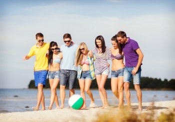 summer, holidays, vacation, happy people concept - group of friends having fun with ball on the beach