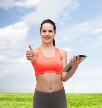 sport, exercise, technology, internet and healthcare - sporty woman with tablet pc computer showing thumbs up