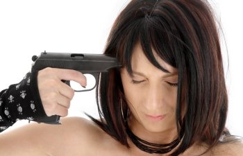 brunette girl pointing  gun at her head