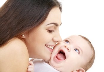 laughing baby playing with mother (focus on mama)
