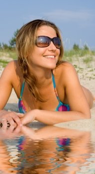 picture of pretty woman relaxing on the beach