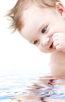 picture of happy blue-eyed baby boy in water