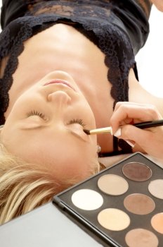 lovely blond laying at professional makeup studio