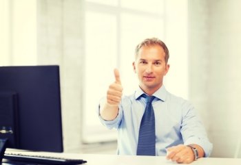 picture of smiling businessman showing thumbs up