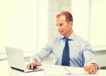 picture of smiling businessman working in office