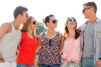 friendship, leisure, summer and people concept - group of smiling friends in city