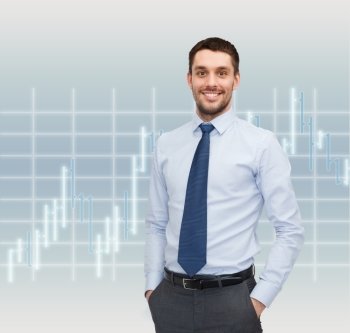 business and people concept - smiling young and handsome businessman over forex chart background