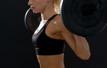 fitness, sport and dieting concept - close up of sporty woman exercising with barbell